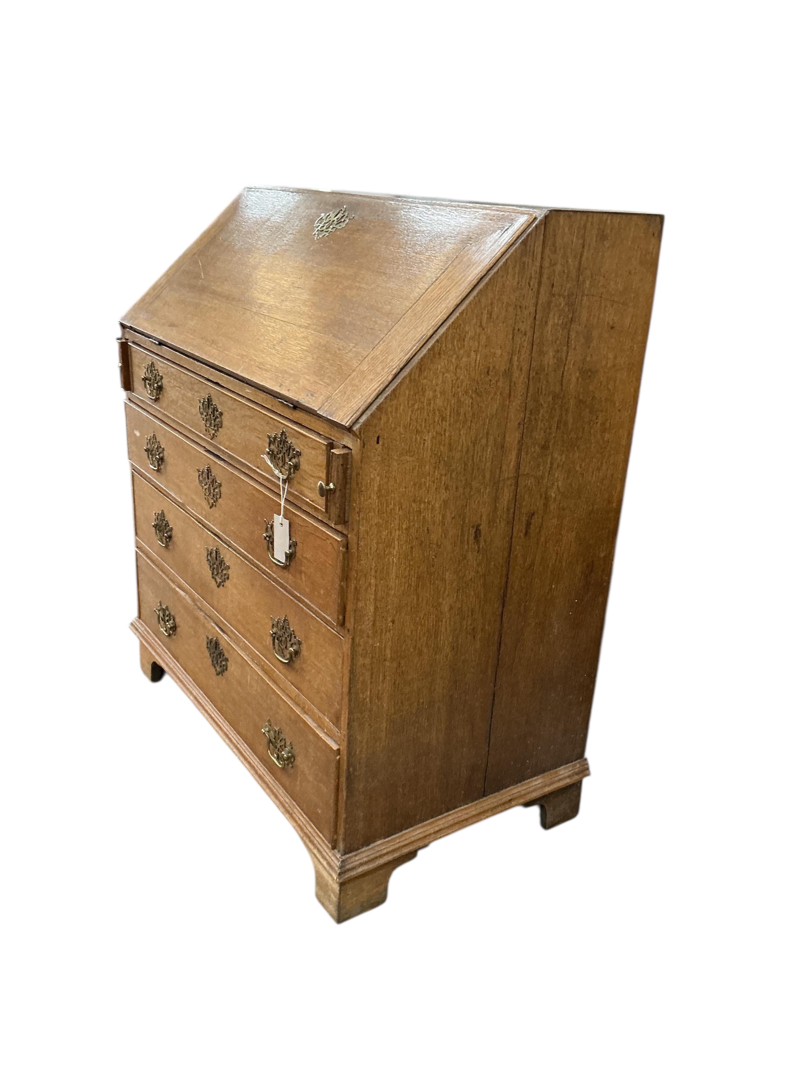 A George III oak bureau, width 91cm, depth 52cm, height 105cm